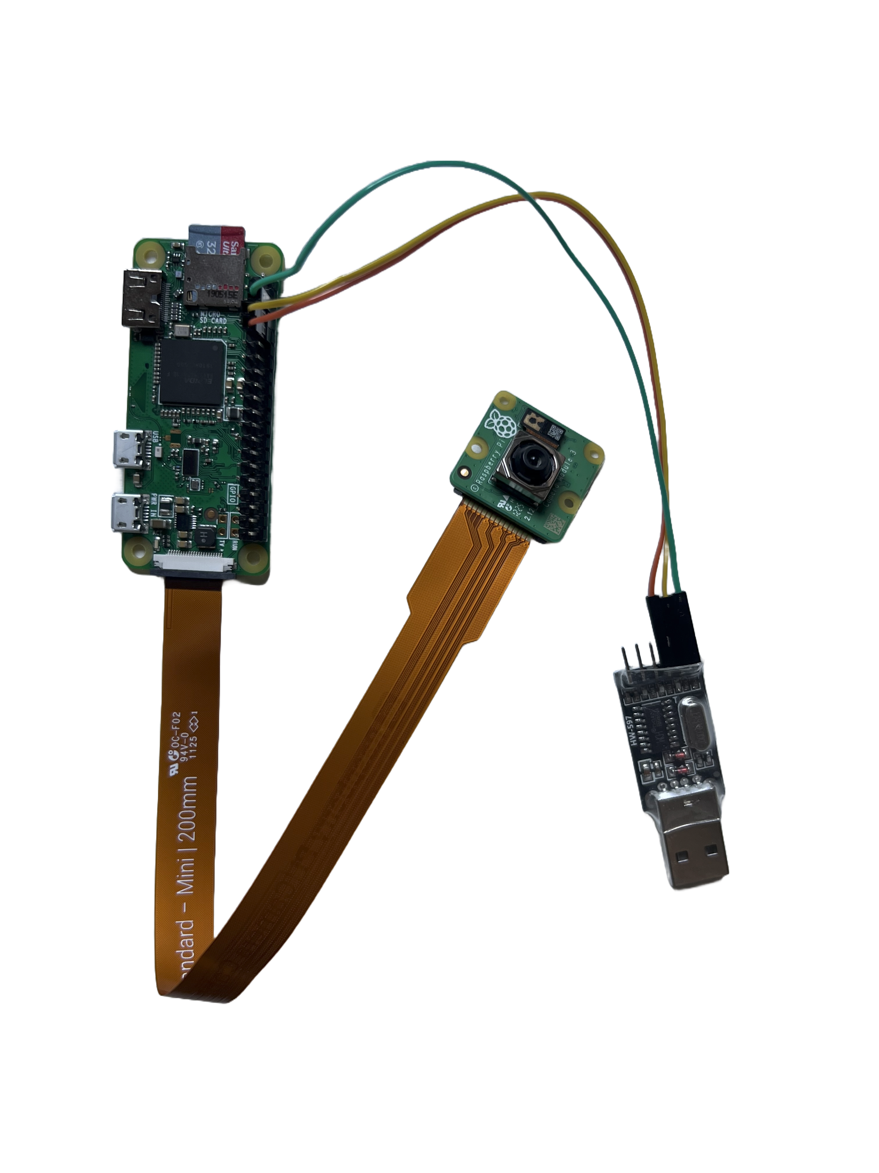 photo of raspberry pi 0 w connected to camera module v3 and usb to ttl adapter.